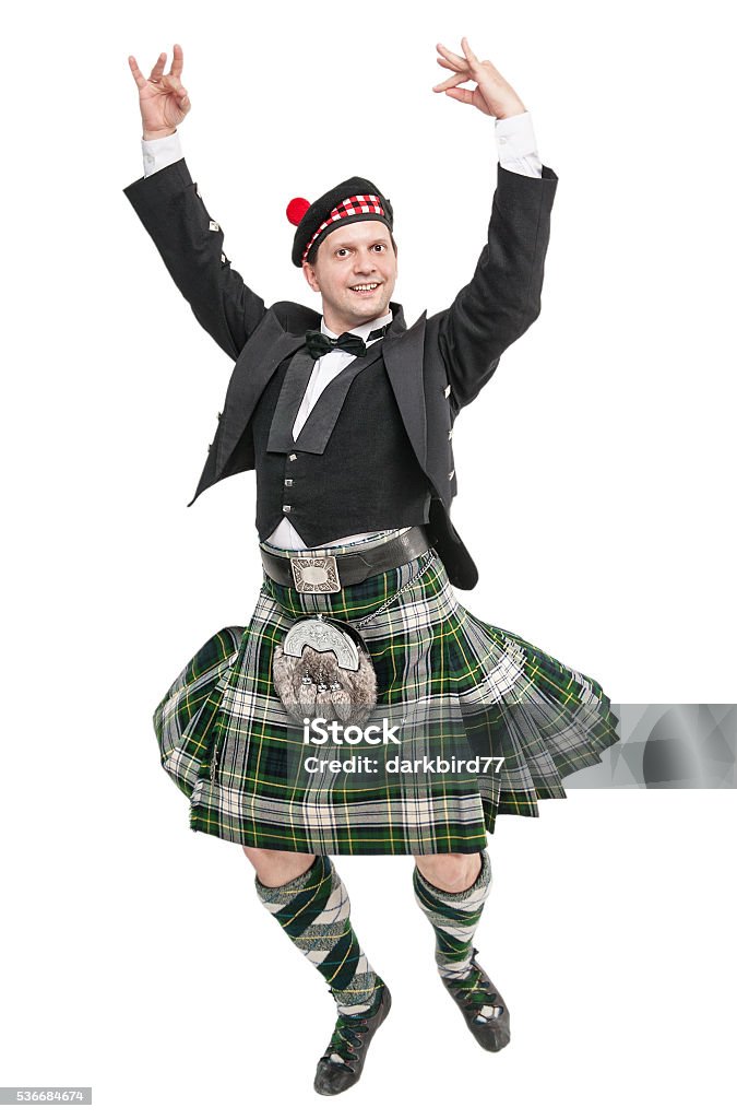 Young man in clothing for Scottish dance Young man in clothing for Scottish dance isolated Kilt Stock Photo