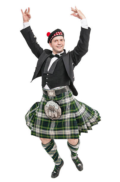 Young man in clothing for Scottish dance Young man in clothing for Scottish dance isolated kilt stock pictures, royalty-free photos & images