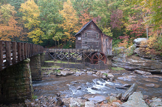 istock 1800's era mill surrounded by Fall foliage 536684743