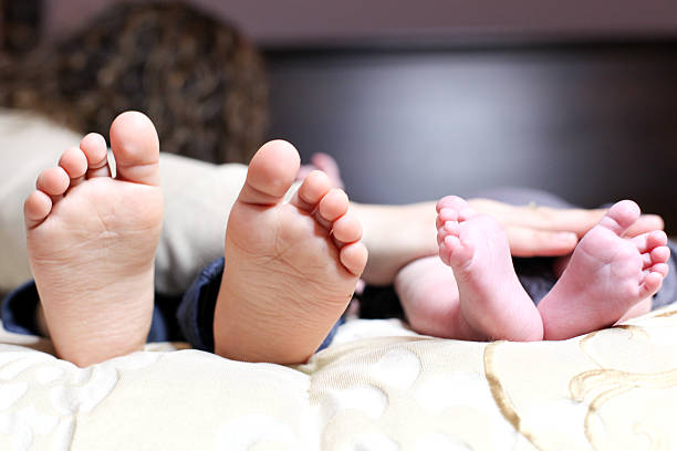 istock cute baby feet 536685154