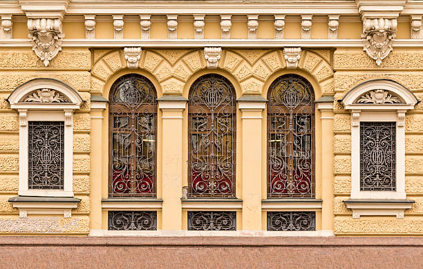 istock Windows in a row with wrought grate on facade 536685164