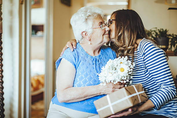 Joyful moment Senior woman is celebrating her birthday with her daughter mother day gift stock pictures, royalty-free photos & images