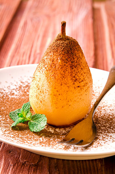 istock Poached pears with cocoa and mint on white plate 536686756