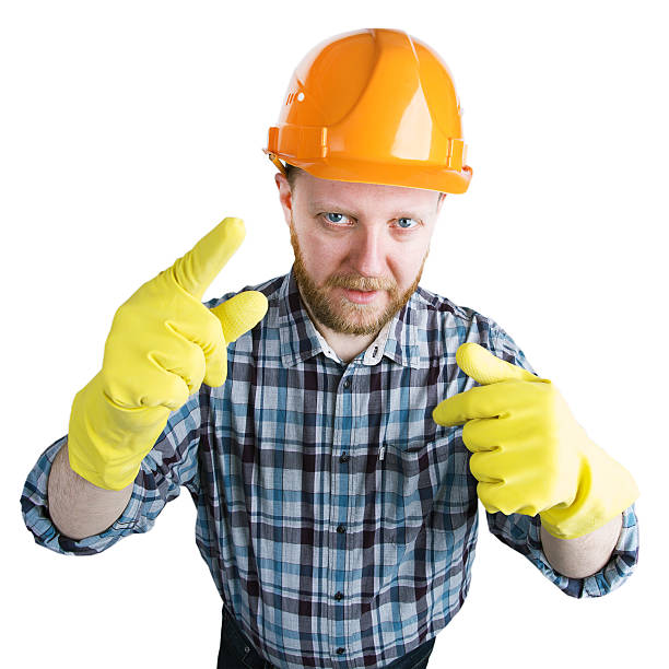 istock Man in an helmet and yellow gloves 536687496