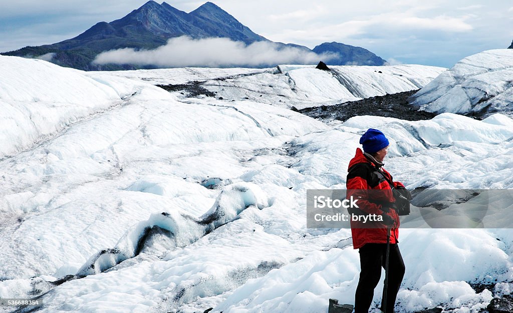 Glacier hiking in Alaska Caucasian woman hiking in a majestic landscape towards the Matanuska Glacier in Alaska. Matanuska Glacier Stock Photo