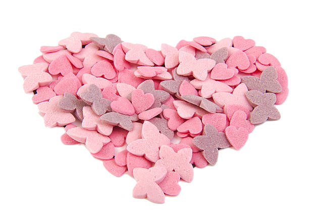 istock Love heart shape formed with sugar items isolated on white 536719329