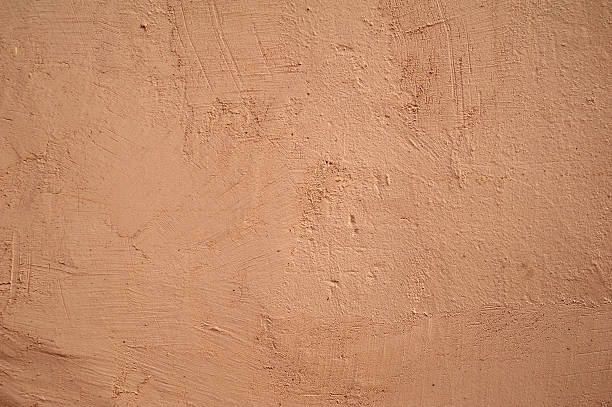 istock Texture of old wall covered with pink stucco 536719343