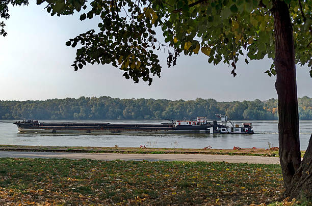 istock Tugboat with ship pass along the riverside park in Ruse 536719507