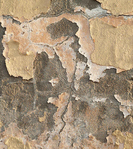 istock Texture of old wall covered with yellow stucco 536719545