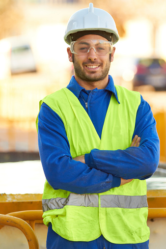 Portrait of a construction worker wearing protective glasses and smiling at youhttp://195.154.178.81/DATA/istock_collage/385879/shoots/781465.jpg