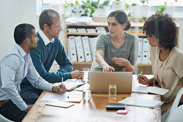 In union there is strength Candid image of a business woman explaining issues to her staffhttp://195.154.178.81/DATA/istock_collage/1200103/shoots/784724.jpg computer software stock pictures, royalty-free photos & images