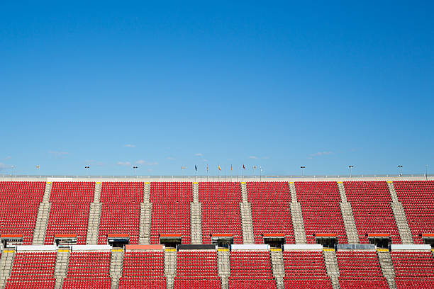 istock empty red seats in  a spanish football stadium with flaggs 536721049