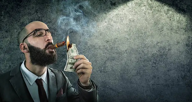 Photo of money burning - businessman arrogant