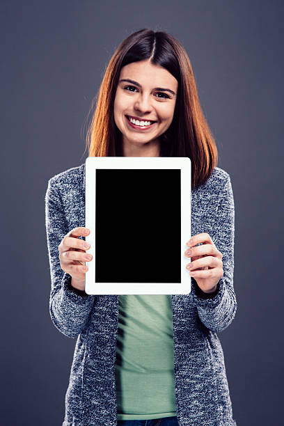istock Young girl holding tablet 536723039