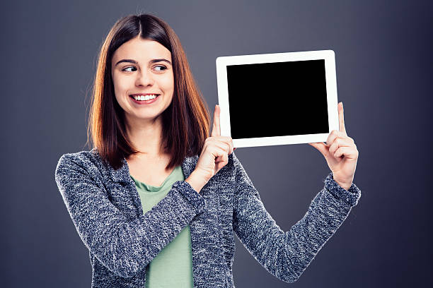 istock Young girl holding tablet 536723041