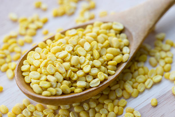 istock Yellow millet on wooden spoon 536740634