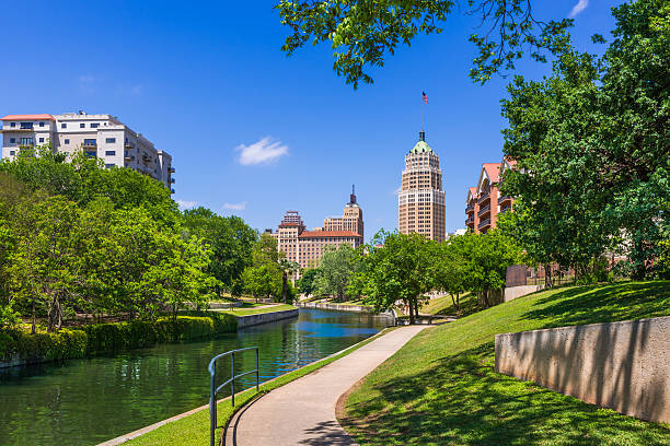 Riverwalk San Antonio Texas skyline, park walkway, scenic river canal stock photo