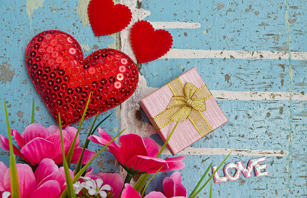 istock Gift and hearts on wooden board, Valentines Day backgroun 536748235