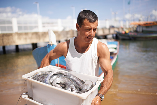 Cropped shot of a fisherman carrying the fish he caughthttp://195.154.178.81/DATA/istock_collage/0/shoots/783243.jpg
