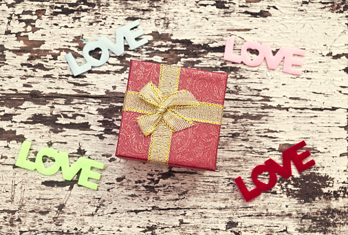 Still life of gift box on grunge wood background, valentine background