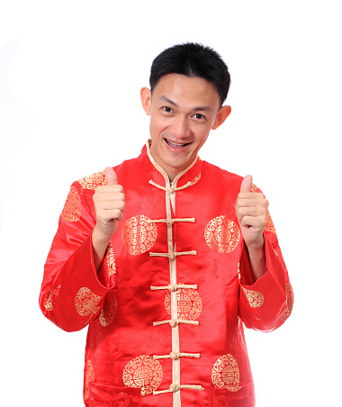 Happy Chinese new year.Young Asian man with gesture of congratulation
