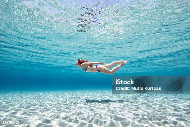 Beautiful Young Woman Swimming Stock Photo - Download Image Now - Women, Underwater, Below