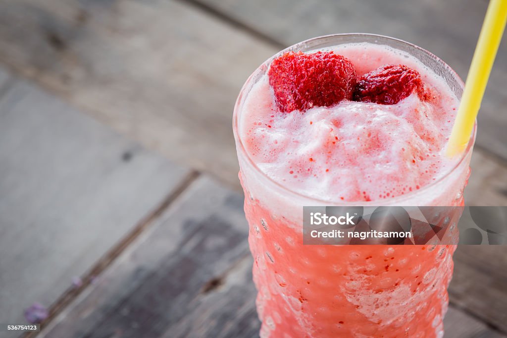 Strawberry Smoothie on wood table. Strawberry Smoothie on wooden table. 2015 Stock Photo