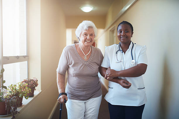 istock Nurse assisting a senior patient to walk 536765514