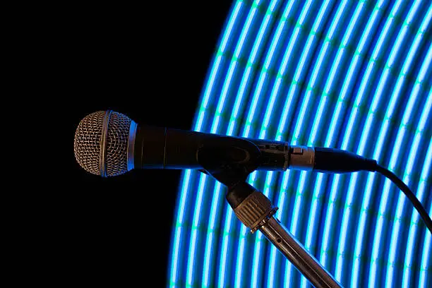Photo of light blue arc behind microphone
