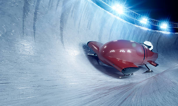 Bobsleigh Team At Night Stock Photo - Download Image Now - Bobsled, Bobsledding, Luge - iStock