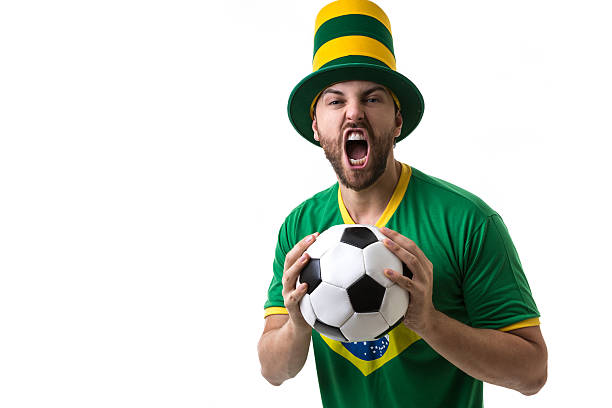 istock Brazilian young fan celebrating on white background 536805752