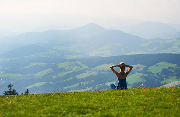 istock Woman sitting on mountain top 536808572
