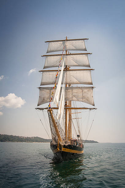 istock Old ship with white sales, sailing in the sea 536809469