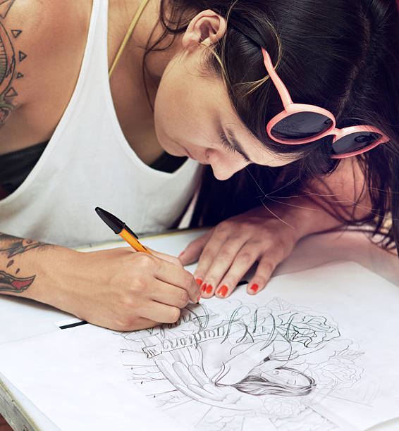 Tattoo artist at work - a masterpiece is born