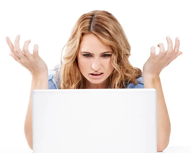 Cropped shot of a frustrated young woman using her laptophttp://195.154.178.81/DATA/istock_collage/356960/shoots/780571.jpg