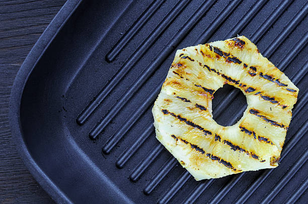 istock Fried pineapple on the grill. Cooking fish burger. 536811809