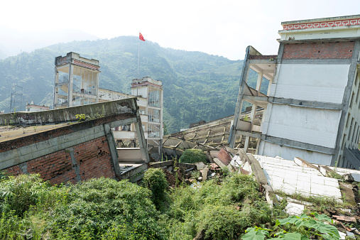 Wenchuan, China - July 26, 2012: Destroyed school building after the earthquake in 2008. The earthquake happened in May 12,2008 deprived about 70000 lives.