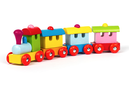 Colored wooden toy train on white background.