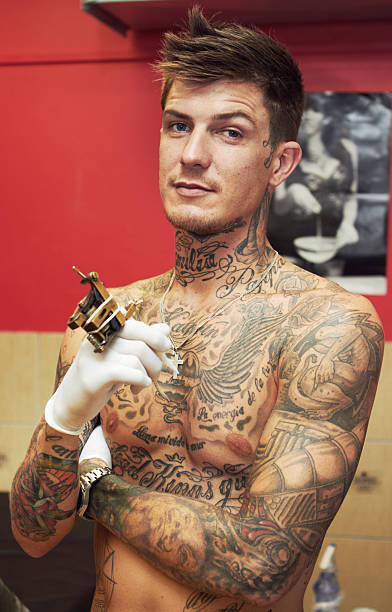 Tattooing is my life Portrait of a handsome young tattoo artist with tattoos on his upper bodyhttp://195.154.178.81/DATA/istock_collage/0/shoots/780556.jpg chest tattoos for men designs stock pictures, royalty-free photos & images