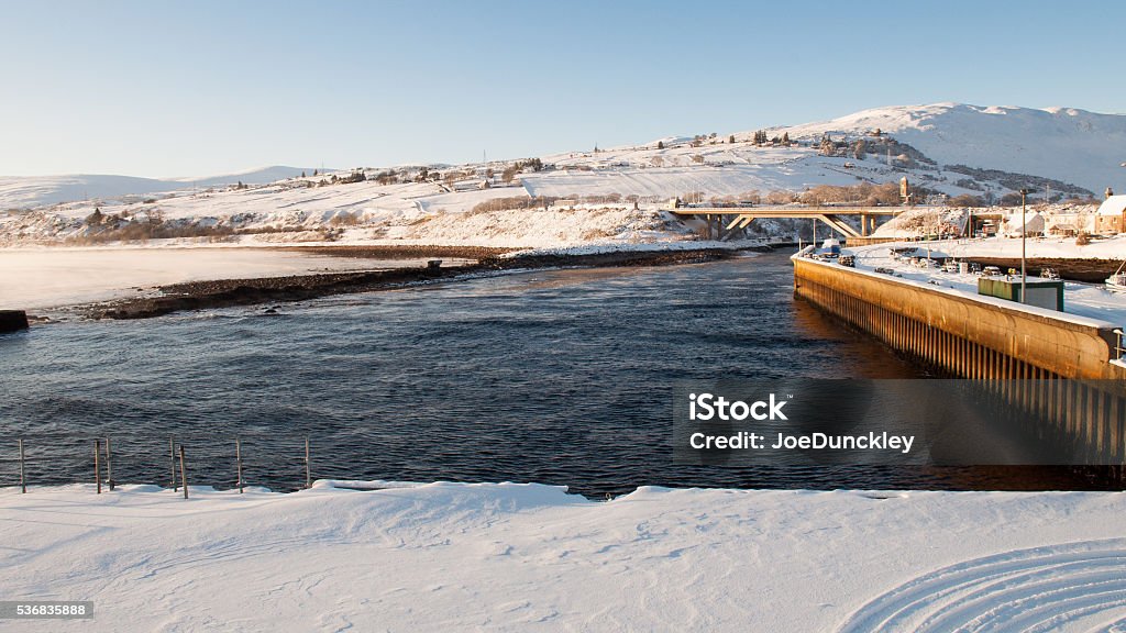 Helmsdale Harbour Winter snow lays thick on the breakwaters of Helmsdale Harbour in Sutherland, in the far north of the Highlands of Scotland. Bridge - Built Structure Stock Photo