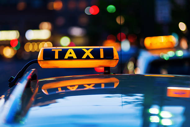 istock taxi sign at night 536843736