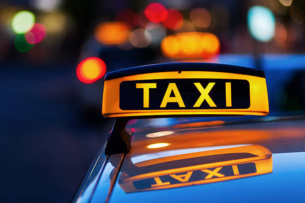 istock taxi sign at night 536843792