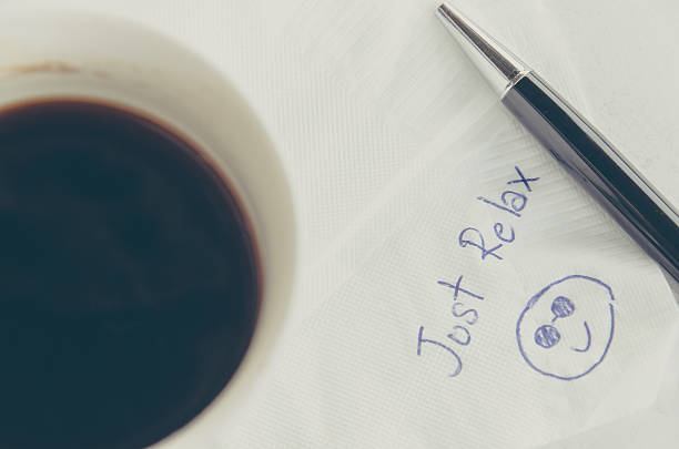 istock cup of Coffee and pen with word 'Just Relax' 536844808