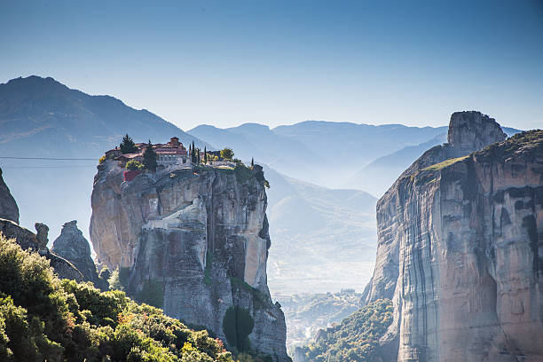 A look at the Kalambaka scenery, also called Kalabaka, where the Meteoras are in the Thessaly Plain in Greece. The monasteries were built on sandstone rock pillars.