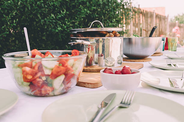 istock Grill on a table surrounded by plates with meal 536847844