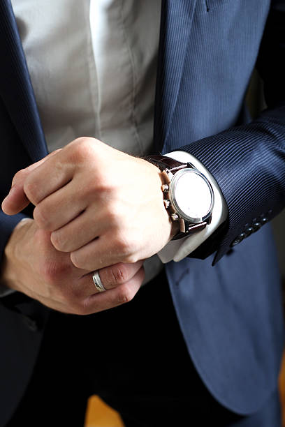 istock Gentleman wearing suit and watch 536852087