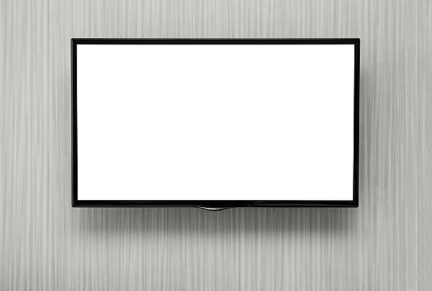 Blank TV Close up of blank flat screen TV at the wall with copy spae and clipping path for the screen flat screen stock pictures, royalty-free photos & images