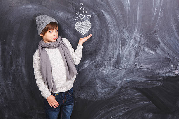 istock Cute boy with heart in hand 536854137