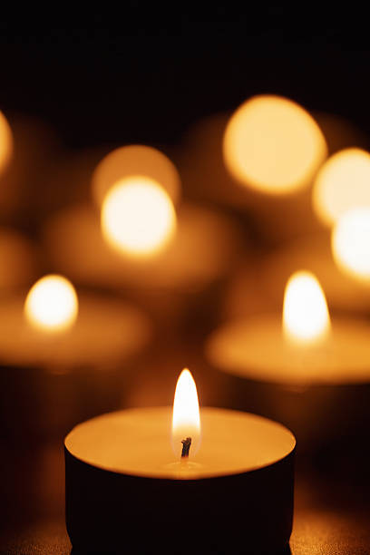 istock burning candles with beautiful out of focus 536854377