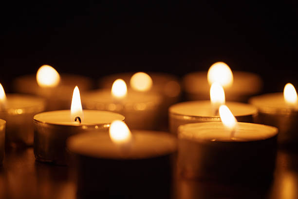 istock burning candles with beautiful out of focus 536854381